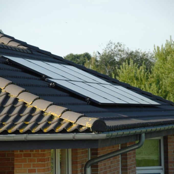 a solar panel on the roof of a house